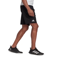 Adidas Men's Club Stretch Woven 7-Inch Shorts (Black/White) -Head Store GL5409 APP on model walking white c6927ead fdd9 4671 a841 3fcc6f756531